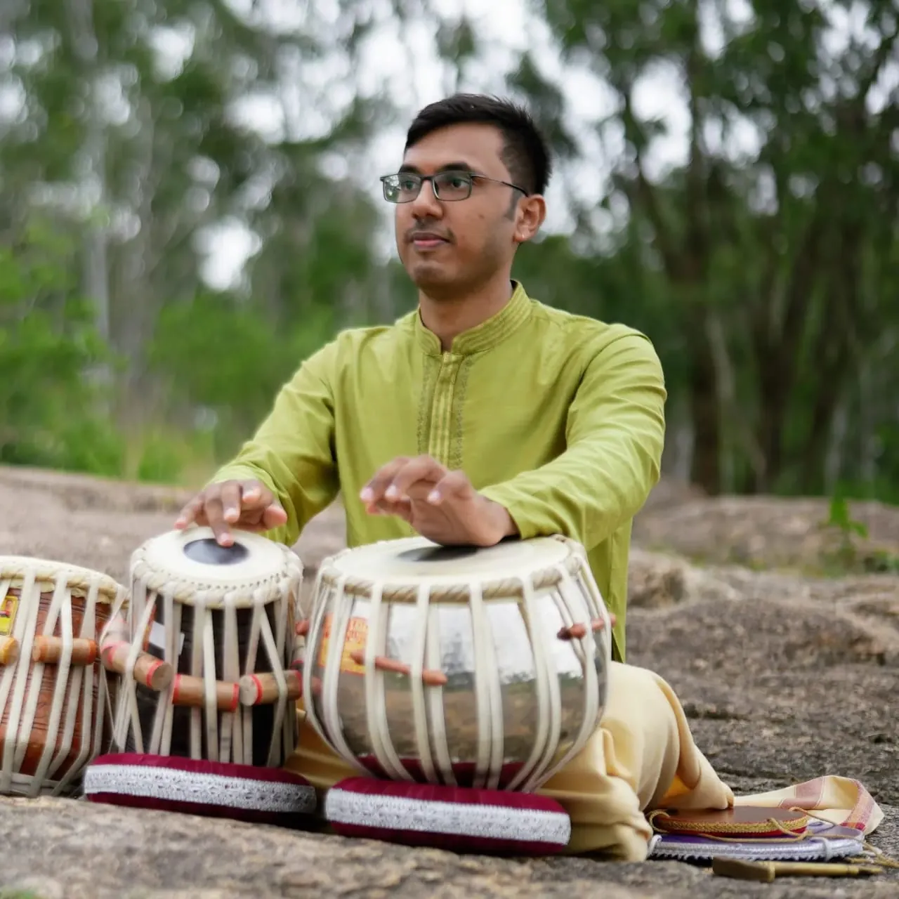 Kaushik Bhat practising tabla riyaz outdoors near Bangalore
