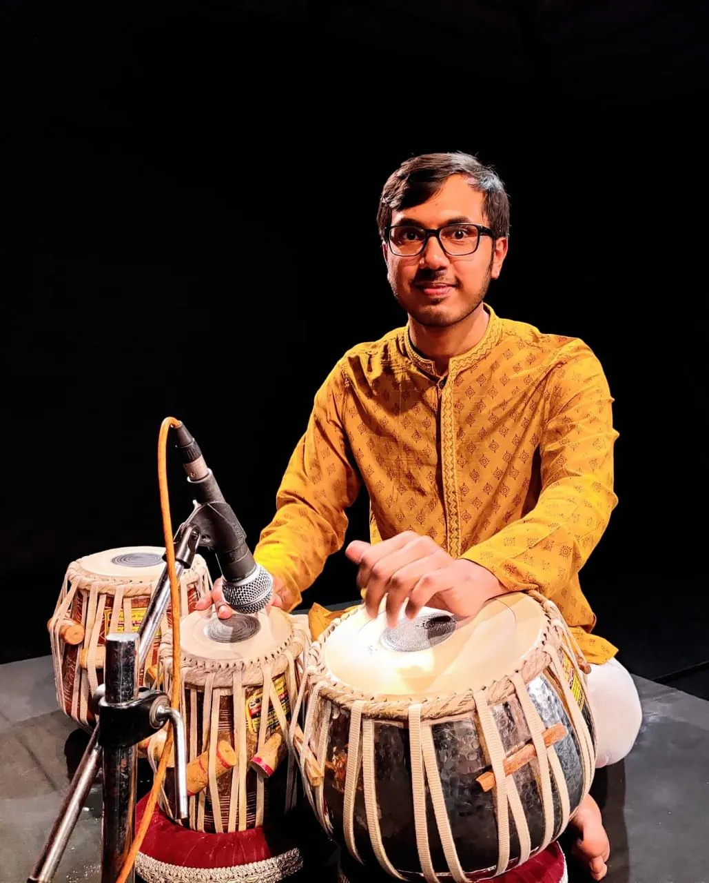 Kaushik Bhat, B-High graded tabla artist, seated at his tabla